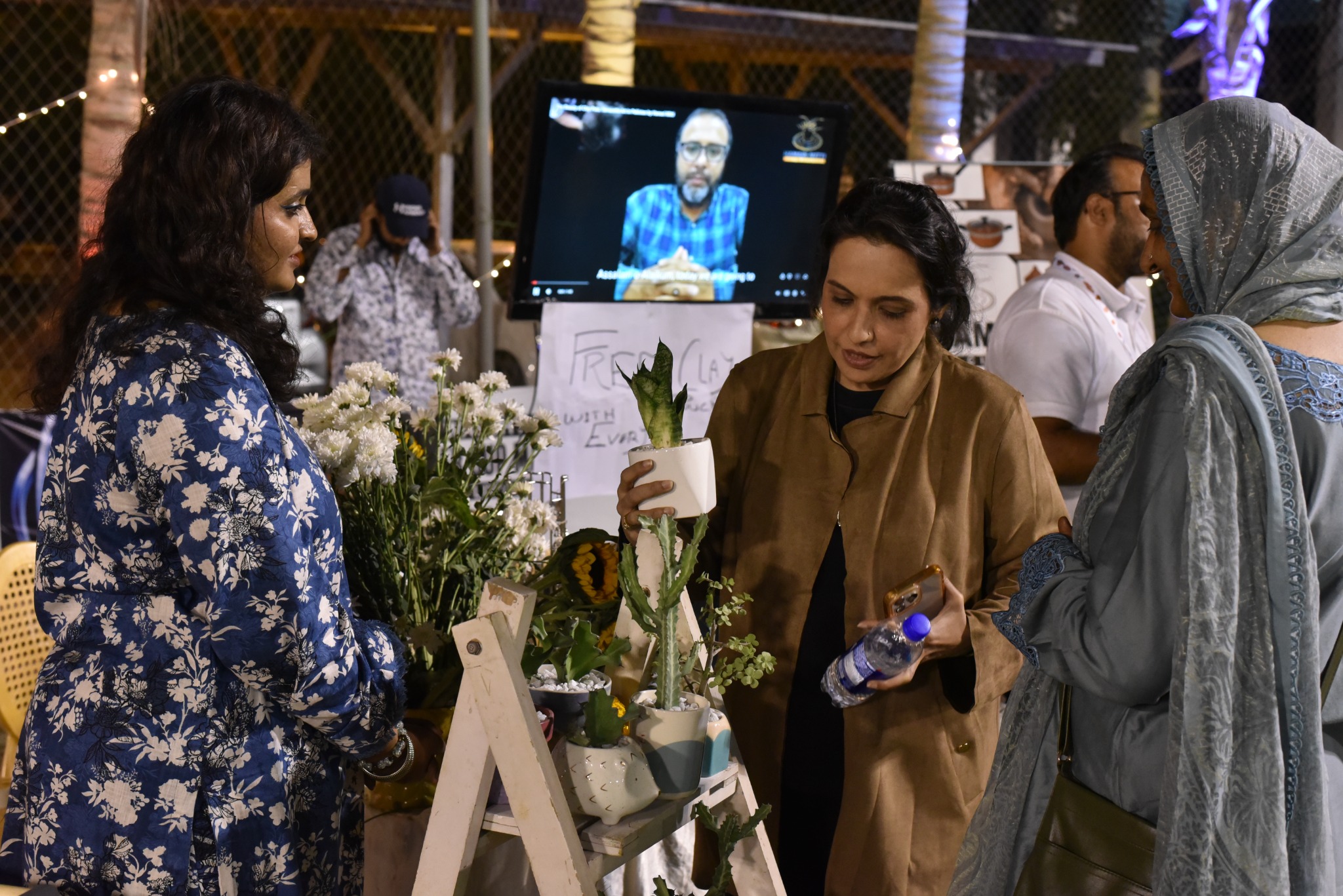 Entrepreneurs speaking to visitors at a previous I-Bazaar